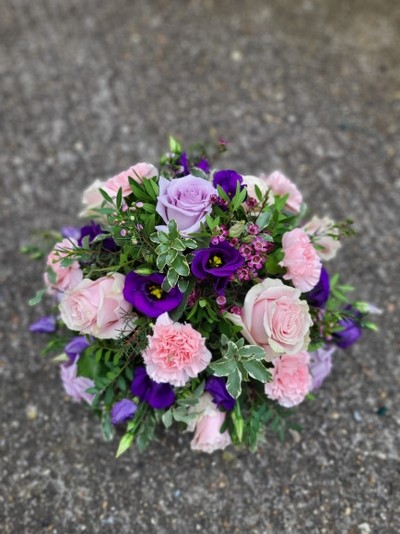 Pink and purple funeral posy made by florist in Croydon 