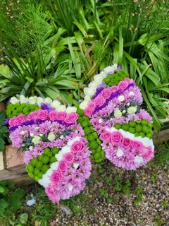 Funeral flowers shaped butterflies made by florist in Croydon, Surrey