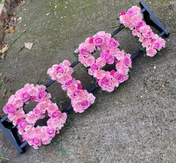 full look luxurious roses and carnations funeral  letters by florist in Croydon, Surrey.