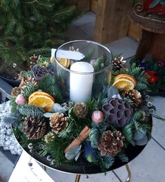 Christmas table centerpiece with pillar candle inside a glass vase handmade by florist in Croydon for flower delivery in CR0 CR2 CR3 CR4 CR5 CR6 CR7 CR8 SM1 SM2 SM5 SE25 BR4