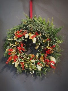 Holly and ilex berries door wreath handmade by local florist in Croydon, South London.