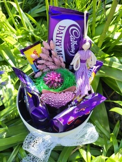 Hat box with Cadbury products with indoor planter in ceramic pot made by florist in Croydon 