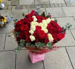 Big bouquet of red roses with white initial letter inside made by florist delivering to Croydon, Surrey