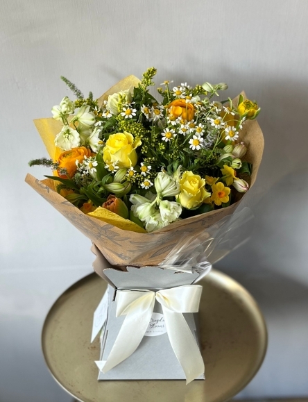 Spring Delicacy bouquet to include yellow spray roses, narcissus, daisies, tanacethum, rununculus presented in a gift box by florist in Croydon, Surrey, UK